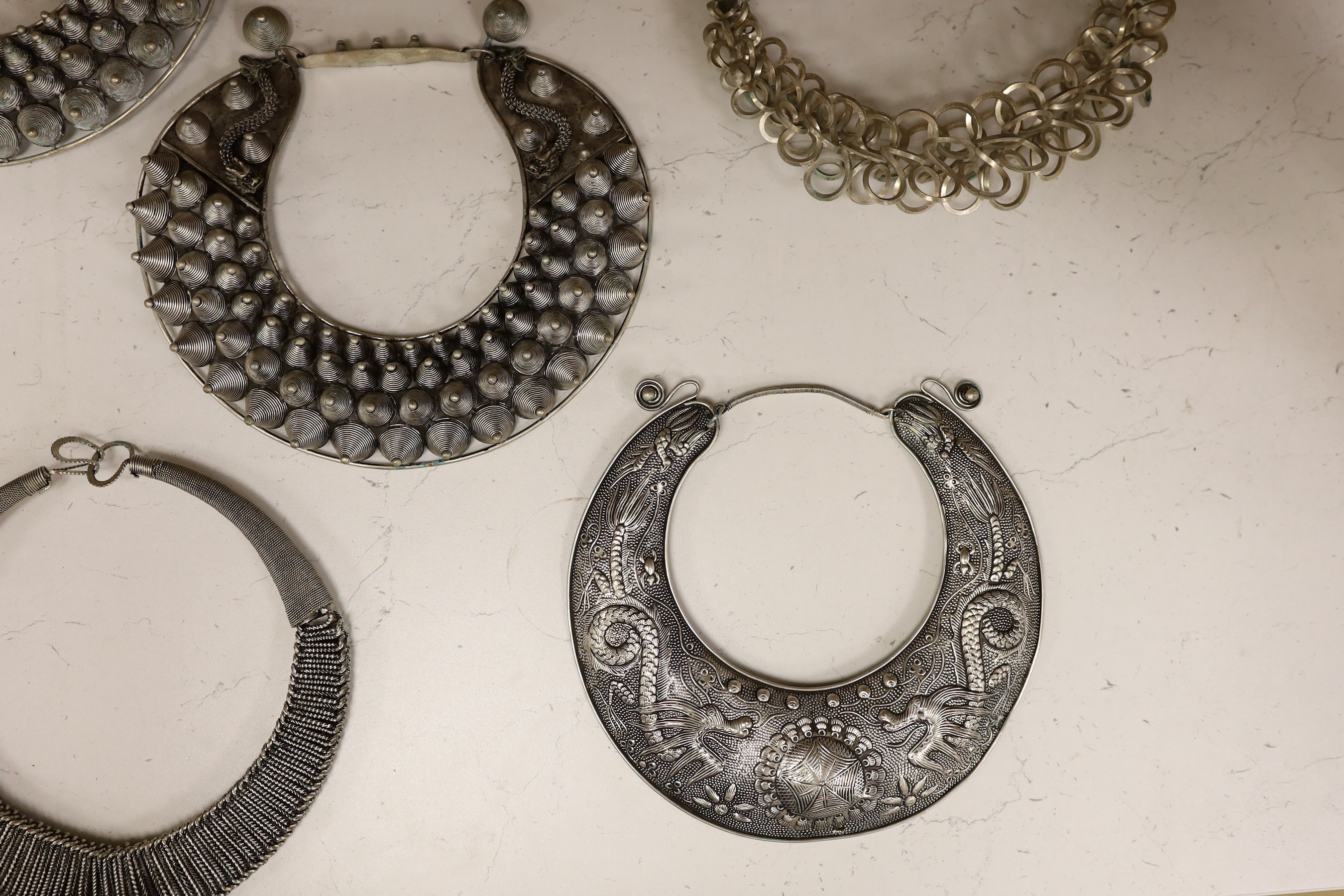 Six various south East Asian white metal collars